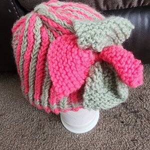 A custom women's made hot pink , green knitted flower hat